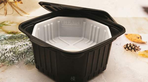 Editorial illustration for The Chemistry and Engineering Behind Self-Heating Food Packaging